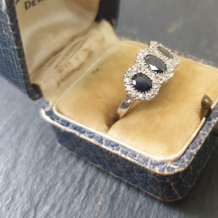 Sapphire Diamond Halo Trilogy Ring from Ace Jewellery, Leeds