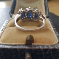 Sapphire Diamond Halo Trilogy Ring from Ace Jewellery, Leeds