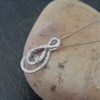 9ct White Gold Dance Diamond Infinity Pendant 0.50ct from Ace Jewellery, Leeds