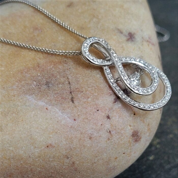 9ct White Gold Dance Diamond Infinity Pendant 0.50ct from Ace Jewellery, Leeds