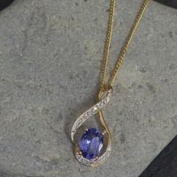 1.06ct Tanzanite & Diamond Swirl Pendant Necklace 9ct Yellow Gold from Ace Jewellery, Leeds