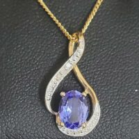 1.06ct Tanzanite & Diamond Swirl Pendant Necklace 9ct Yellow Gold from Ace Jewellery, Leeds