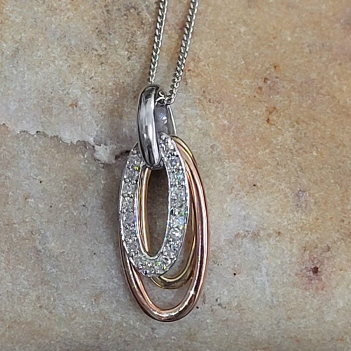 0.08ct Diamond 9ct Mixed Metal Oval Pendant Necklace from Ace Jewellery, Leeds