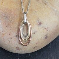 0.08ct Diamond 9ct Mixed Metal Oval Pendant Necklace from Ace Jewellery, Leeds