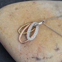 0.08ct Diamond 9ct Mixed Metal Oval Pendant Necklace from Ace Jewellery, Leeds