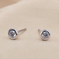Platinum 0.29ct Collet-Set Diamond Solitaire Stud Earrings from Ace Jewellery, Leeds