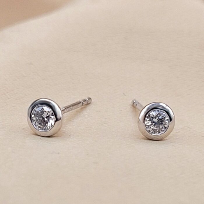 Platinum 0.29ct Collet-Set Diamond Solitaire Stud Earrings from Ace Jewellery, Leeds