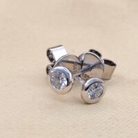 Platinum 0.29ct Collet-Set Diamond Solitaire Stud Earrings from Ace Jewellery, Leeds