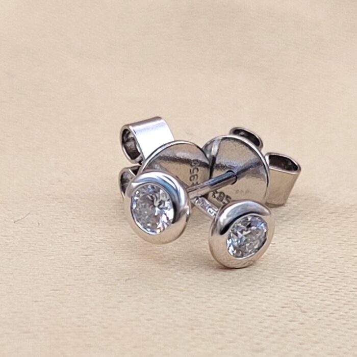 Platinum 0.29ct Collet-Set Diamond Solitaire Stud Earrings from Ace Jewellery, Leeds