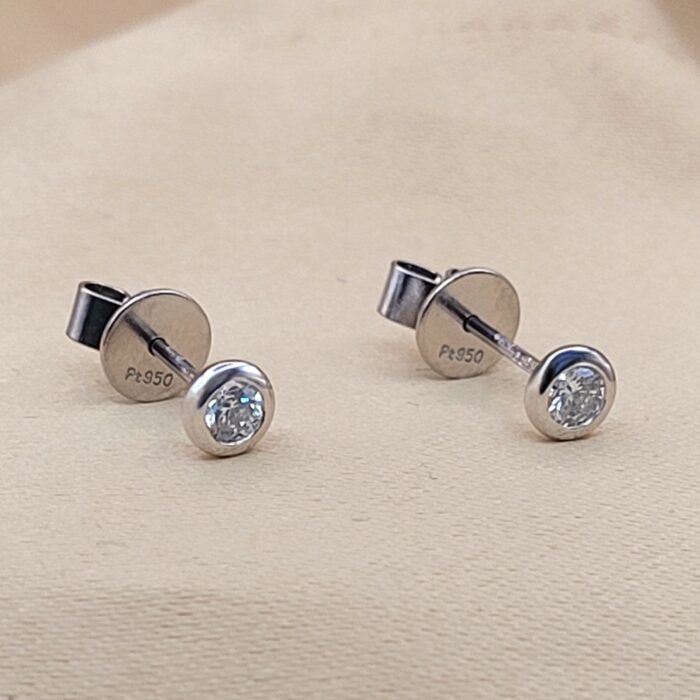 Platinum 0.29ct Collet-Set Diamond Solitaire Stud Earrings from Ace Jewellery, Leeds