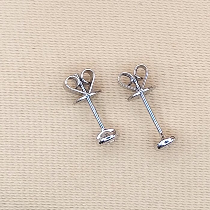 Platinum 0.29ct Collet-Set Diamond Solitaire Stud Earrings from Ace Jewellery, Leeds