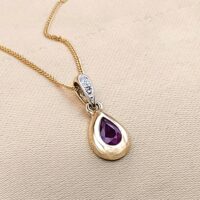 0.54ct Pear-Shaped Ruby & Diamond Teardrop Pendant Necklace 9ct Yellow Gold from Ace Jewellery, Leeds