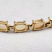 Vintage Style Opal Tennis Bracelet 9ct Yellow Gold from Ace Jewellery, Leeds