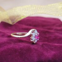 0.65ct Ruby & Diamond Cluster Crossover Ring 18ct Yellow Gold from Ace Jewellery, Leeds