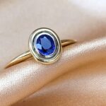 0.40ct Oval Sapphire Collet-Set Ring 18ct Yellow Gold from Ace Jewellery, Leeds